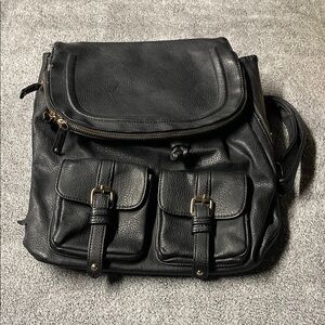 Aldo Black Faux Leather Backpack with Buckle Front Pockets and Gold Hardware
